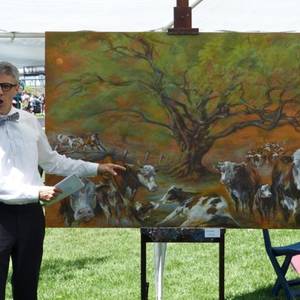 Michael Connolly in the opening scene of Beauty in the Eye. The painting is by Herb Jung, and was part of an environmental show that toured up and down Walton Street in Port Hope in August 2013.